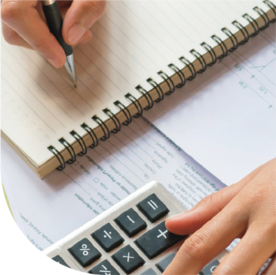 female-using-calculator-while-reviewing-cpa-accounting-reports